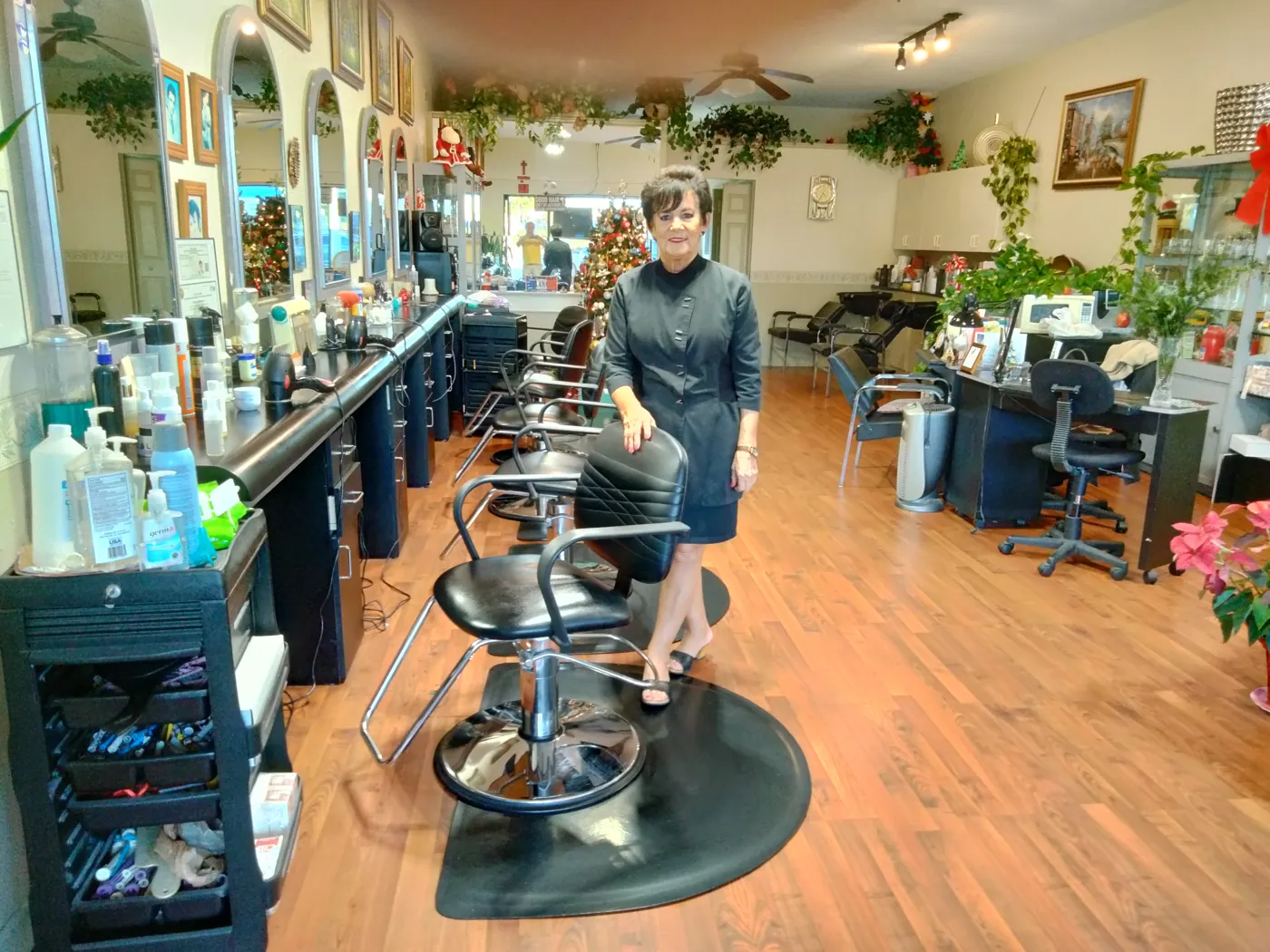 Alicja standing beside the styling stations at La' Riviera Salon